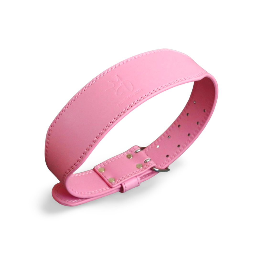 Pink weight lifting belt on a white background