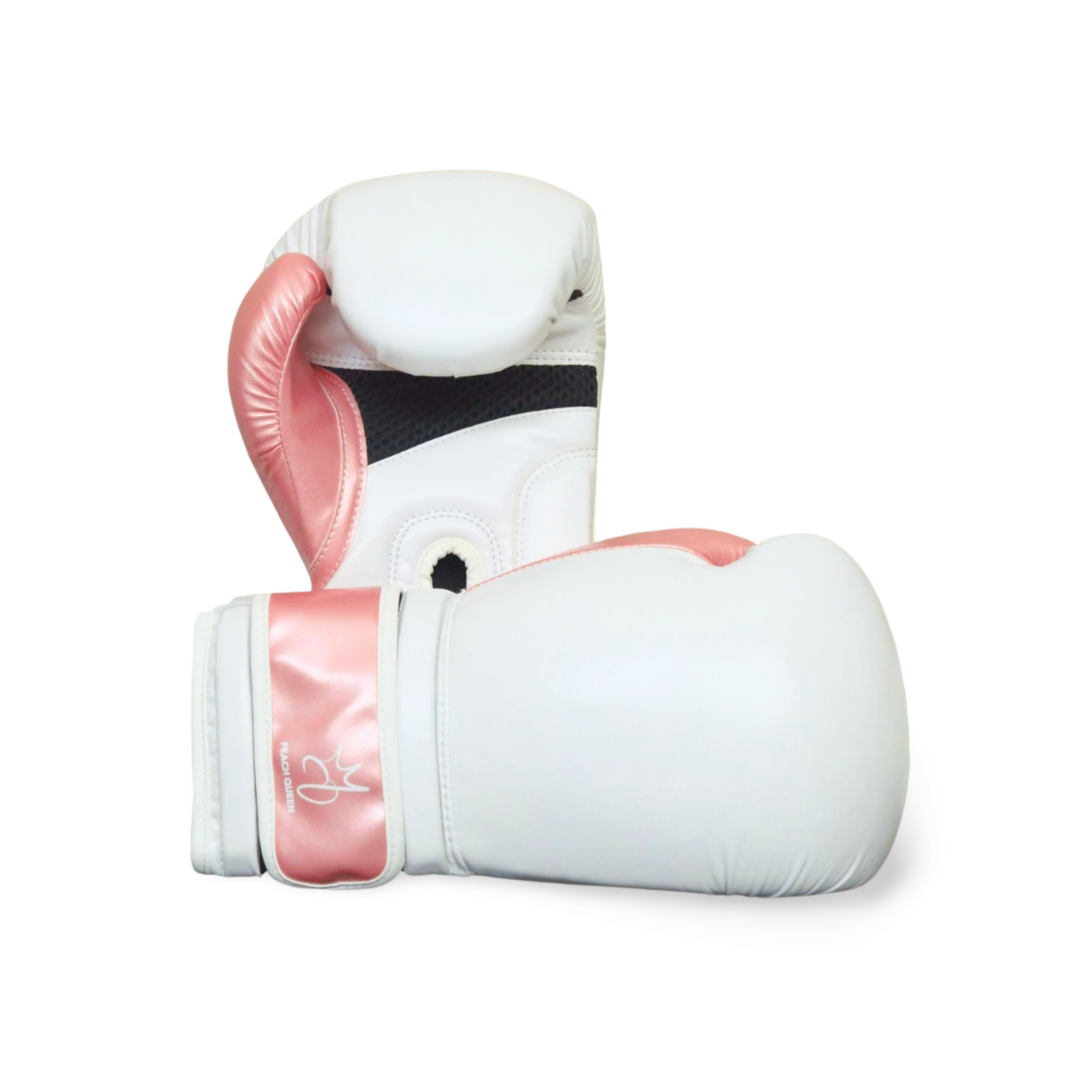 White boxing gloves with pink accents on a white background