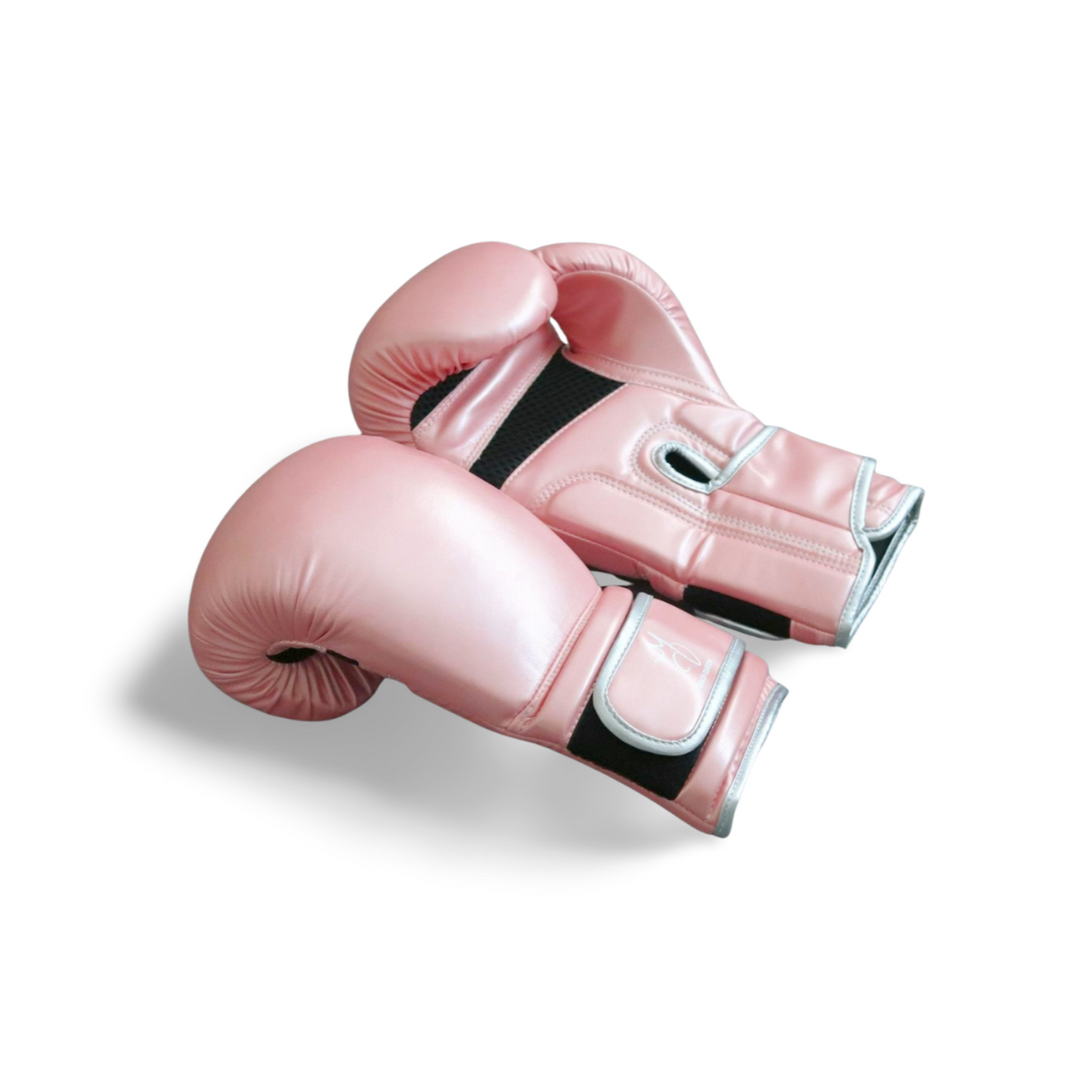 Pair of pink boxing gloves on a white background